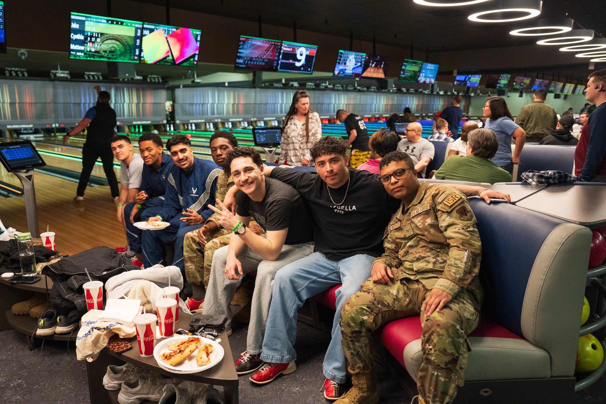 Airmen take a photo together during the Sexual Assault Prevention and Response program's "Strike-out Sexual Assault" event on Joint Base Elmendorf-Richardson, Alaska, April 24, 2026. The event aimed to strengthen unit cohesion and promote a culture of safety by highlighting SAPR's resources in an informal setting. (U.S. Air Force photo by Airman 1st Class Keola Vischi)