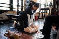 A photo of Rihanna Freeman, a student at the Stafford Medical Center, performing CPR on a manikin during a SkillsUSA competition at the Vermont Air National Guard base in South Burlington, VT, April 8, 2026.