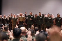 U.S. Marine Corps Col. Robert G. McCarthy III, commanding officer, The Basic School, Training Command, center, delivers the oath of office to Marines with Company I, Warrant Officer Basic Course during an appointment ceremony at Marine Corps Base Quantico, Virginia, April 1, 2026. Enlisted Marines attend the WOBC at TBS to be trained and educated to perform the duties required of a warrant officer in their respective occupational fields. (U.S. Marine Corps photo by Cpl. Joshua Barker)