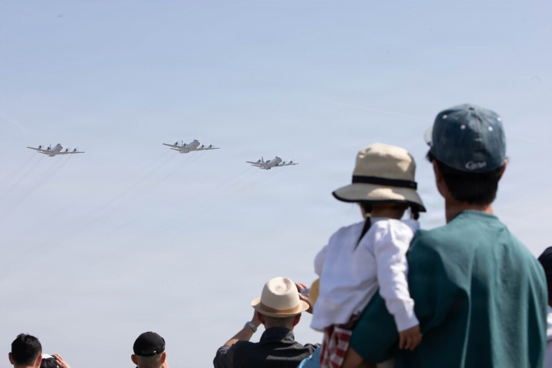 Guests observe a flight demonstration by Air Rescue Squadron 71, Fleet Air Wing 31 during Family Day at Marine Corps Air Station Iwakuni, Japan, May 2, 2026. MCAS Iwakuni’s Family Day gave U.S. and Japanese community members, their families, local orphanages, and individuals with special needs an opportunity to experience a smaller-scale Friendship Day during the air show rehearsal, highlighting the enduring strength of the U.S.-Japan Alliance.  (U.S. Marine Corps photo by Lance Cpl. Tyler Bassett)