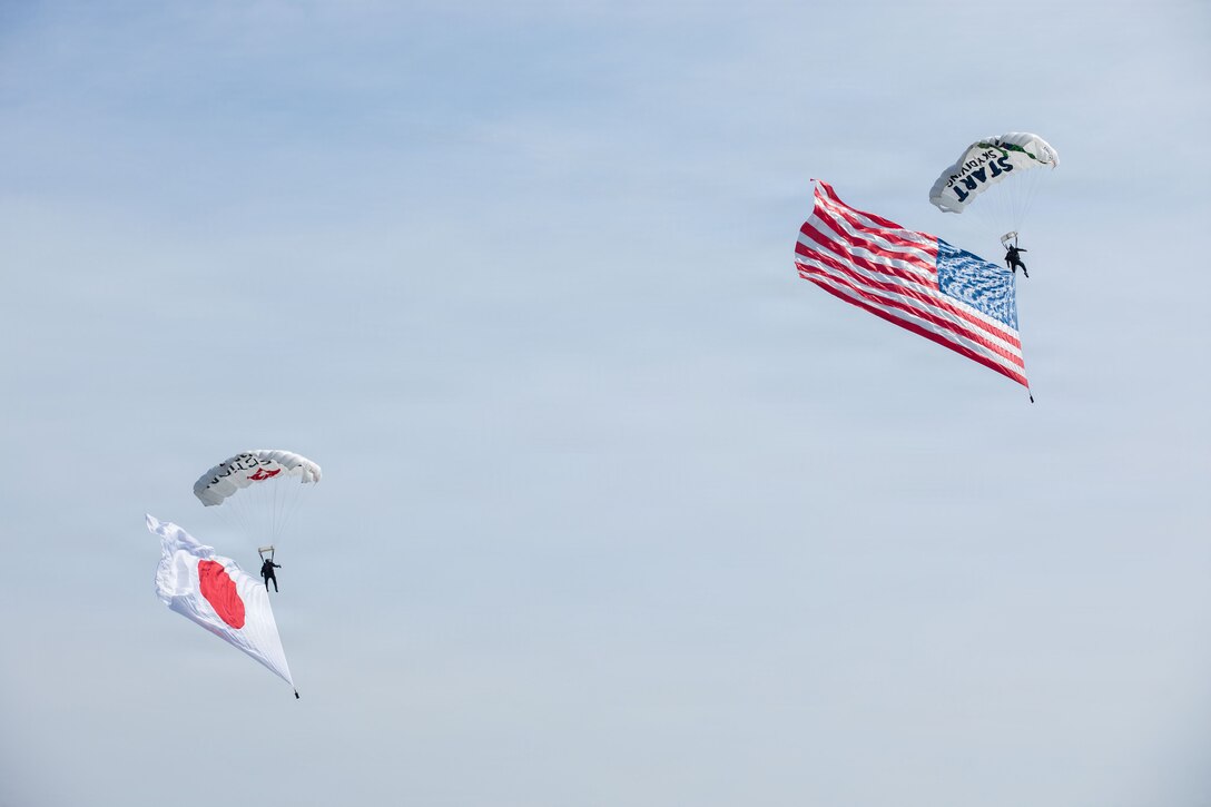 Members of Team Fastrax glide to the ground during Family Day at Marine Corps Air Station Iwakuni, Japan, May 2, 2026. MCAS Iwakuni’s Family Day gave U.S. and Japanese community members, their families, local orphanages, and individuals with special needs an opportunity to experience a smaller-scale Friendship Day during the air show rehearsal, highlighting the enduring strength of the U.S.-Japan Alliance. (U.S. Marine Corps Photo by Cpl. Ella Cadby)