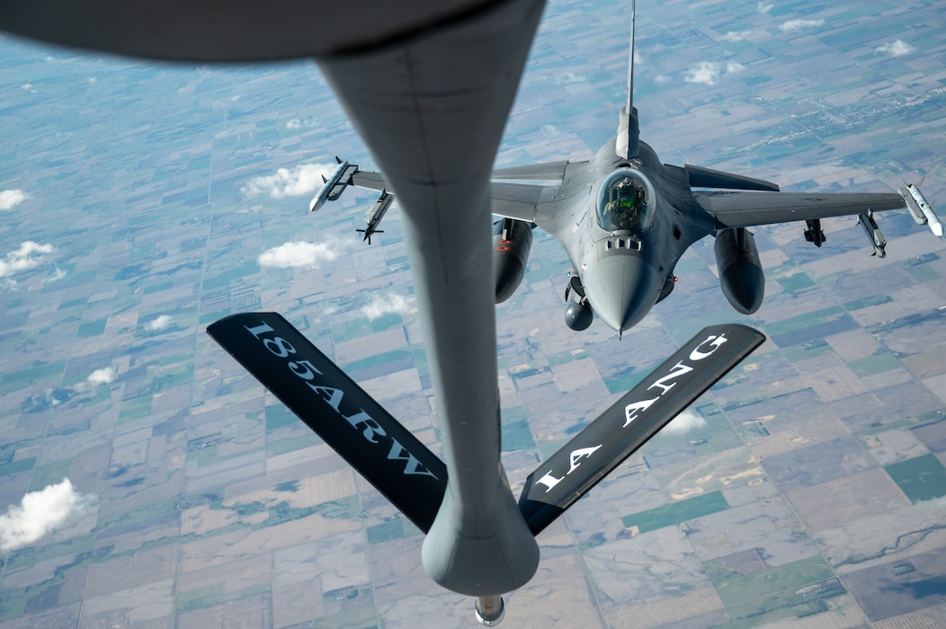 Iowa Air National Guard Airmen assigned to the 185th Air Refueling Wing refuel F-16 Fighting Falcons from the 114th Fighter Wing using a KC-135 Stratotanker during a training mission over the Midwest, May 1, 2026. Aerial refueling extends the range and endurance of military aircraft, enabling global mobility operations.