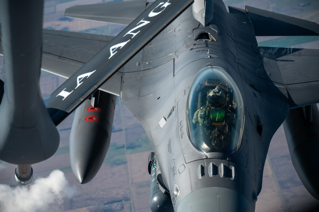 Iowa Air National Guard Airmen assigned to the 185th Air Refueling Wing refuel F-16 Fighting Falcons from the 114th Fighter Wing using a KC-135 Stratotanker during a training mission over the Midwest, May 1, 2026. Aerial refueling extends the range and endurance of military aircraft, enabling global mobility operations.