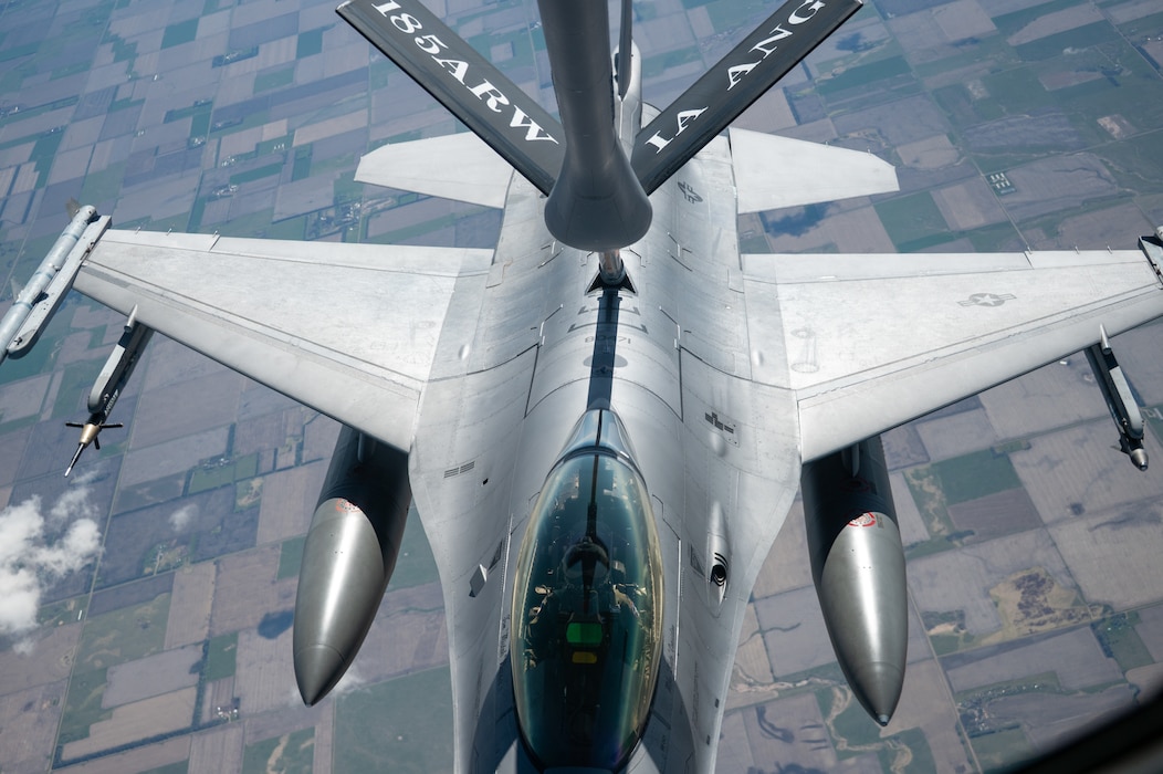 Iowa Air National Guard Airmen assigned to the 185th Air Refueling Wing refuel F-16 Fighting Falcons from the 114th Fighter Wing using a KC-135 Stratotanker during a training mission over the Midwest, May 1, 2026. Aerial refueling extends the range and endurance of military aircraft, enabling global mobility operations.