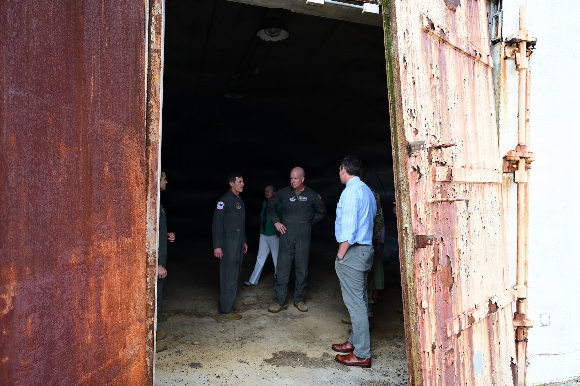 People stand inside of a bunker