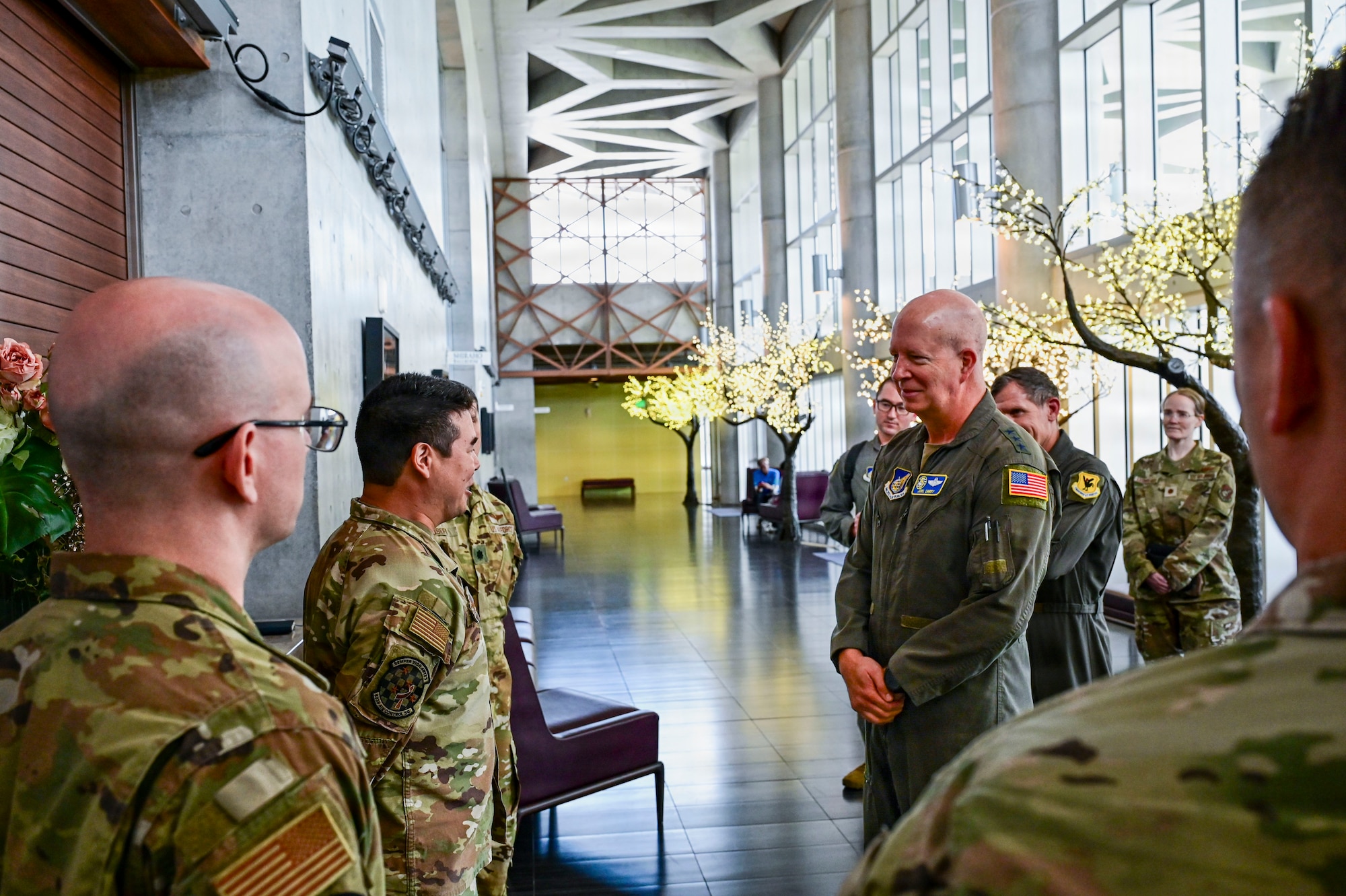 5th Air Force Commander talks to an Airman during a tour at Kadena Air Base