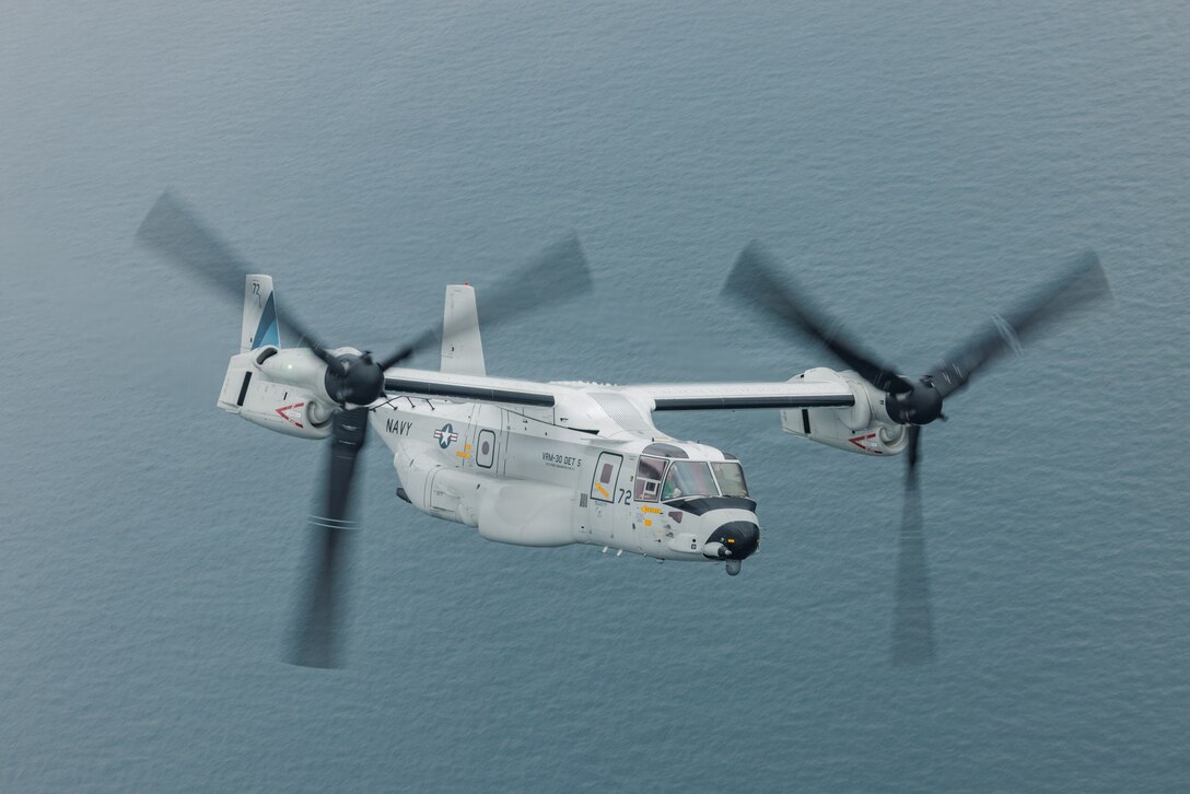 U.S. Navy Lt. Cmdr. Danny Xu and Lt. Benjamin Schierman, both pilots assigned to Carrier Air Wing 5, pilot a U.S. Navy CMV-22B Osprey with Fleet Logistics Multi-Mission Squadron (VRM) 30, Detachment Forward Deployed Naval Forces, during Friendship Day at Marine Corps Air Station Iwakuni, May 3, 2026. Since 1973, MCAS Iwkauni has held an air show designed to foster positive relationships and offer an exciting experience that displays the communal support between the U.S. and Japan. The air show encompassed various U.S. and Japanese static display aircraft, aerial performances, food and entertainment. (U.S. Marine Corps photo by Cpl. Sarah Grawcock)