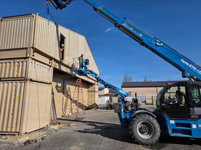 U.S. Airmen assigned to the 51st Civil Engineer Squadron use a crane to assemble an expeditionary storage and protection facility at Osan Air Base, Republic of Korea, 2026. The ESAP facility is a hardened, modular structure that provides protected storage for critical equipment while enhancing the base's readiness and ability to operate in contested environments. (Courtesy photo)