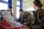 Clinical staff assigned to Landstuhl Regional Medical Center participate in Battlefield Injury Progressive Training led by the Center for Nursing Science and Clinical Inquiry in collaboration with the European Medical Simulation Center, April 2026, in Landstuhl, Germany.. More than 250 joint-service medical personnel completed a three-phase, high-fidelity training program using realistic patient scenarios to strengthen trauma care skills, critical thinking and team performance. The training reinforced medical readiness and prepares personnel to deliver high-quality care in support of the joint warfighter. (DoD Photo by Travis Jones)
