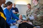 Clinical staff assigned to Landstuhl Regional Medical Center participate in Battlefield Injury Progressive Training led by the Center for Nursing Science and Clinical Inquiry in collaboration with the European Medical Simulation Center, April 2026, in Landstuhl, Germany.. More than 250 joint-service medical personnel completed a three-phase, high-fidelity training program using realistic patient scenarios to strengthen trauma care skills, critical thinking and team performance. The training reinforced medical readiness and prepares personnel to deliver high-quality care in support of the joint warfighter. (DoD Photo by Travis Jones)