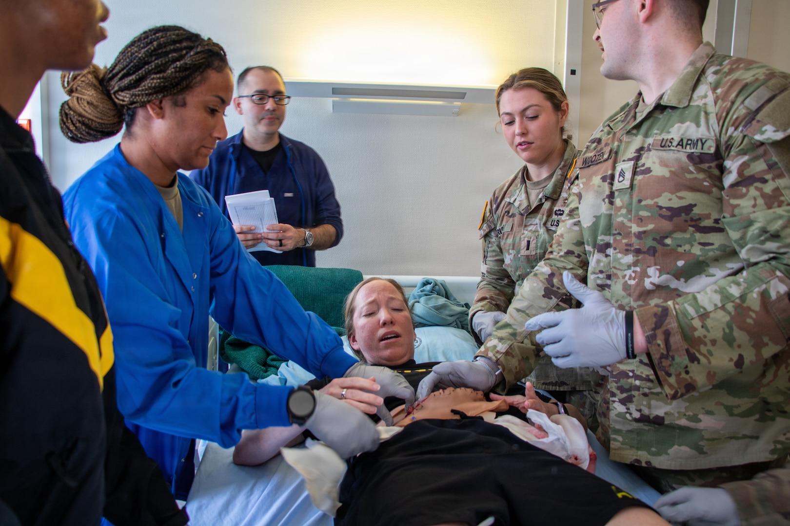 Clinical staff assigned to Landstuhl Regional Medical Center participate in Battlefield Injury Progressive Training led by the Center for Nursing Science and Clinical Inquiry in collaboration with the European Medical Simulation Center, April 2026, in Landstuhl, Germany.. More than 250 joint-service medical personnel completed a three-phase, high-fidelity training program using realistic patient scenarios to strengthen trauma care skills, critical thinking and team performance. The training reinforced medical readiness and prepares personnel to deliver high-quality care in support of the joint warfighter. (DoD Photo by Travis Jones)