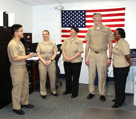 Lt. Cmdr. Matthew Christensen (second from right), Director for Administration (DFA) at Navy Medicine Readiness and Training Command (NMRTC) Patuxent River, leads an active discussion on the day's operations with the command's administrative leadership team. Also pictured (from left to right) are Lt. Brandon Le, the command's Administrative Officer and Navy Manpower Officer; Chief Hospital Corpsman Amanda Ellis; Hospital Corpsman 1st Class Amity Montoya; and Hospital Corpsman 1st Class Ciara Barnes. The Medical Service Corps (MSC) Healthcare Administration team serves as the backbone of medical readiness, managing the complex operations, manpower, and logistics required to drive the operational and administrative engine of the command.