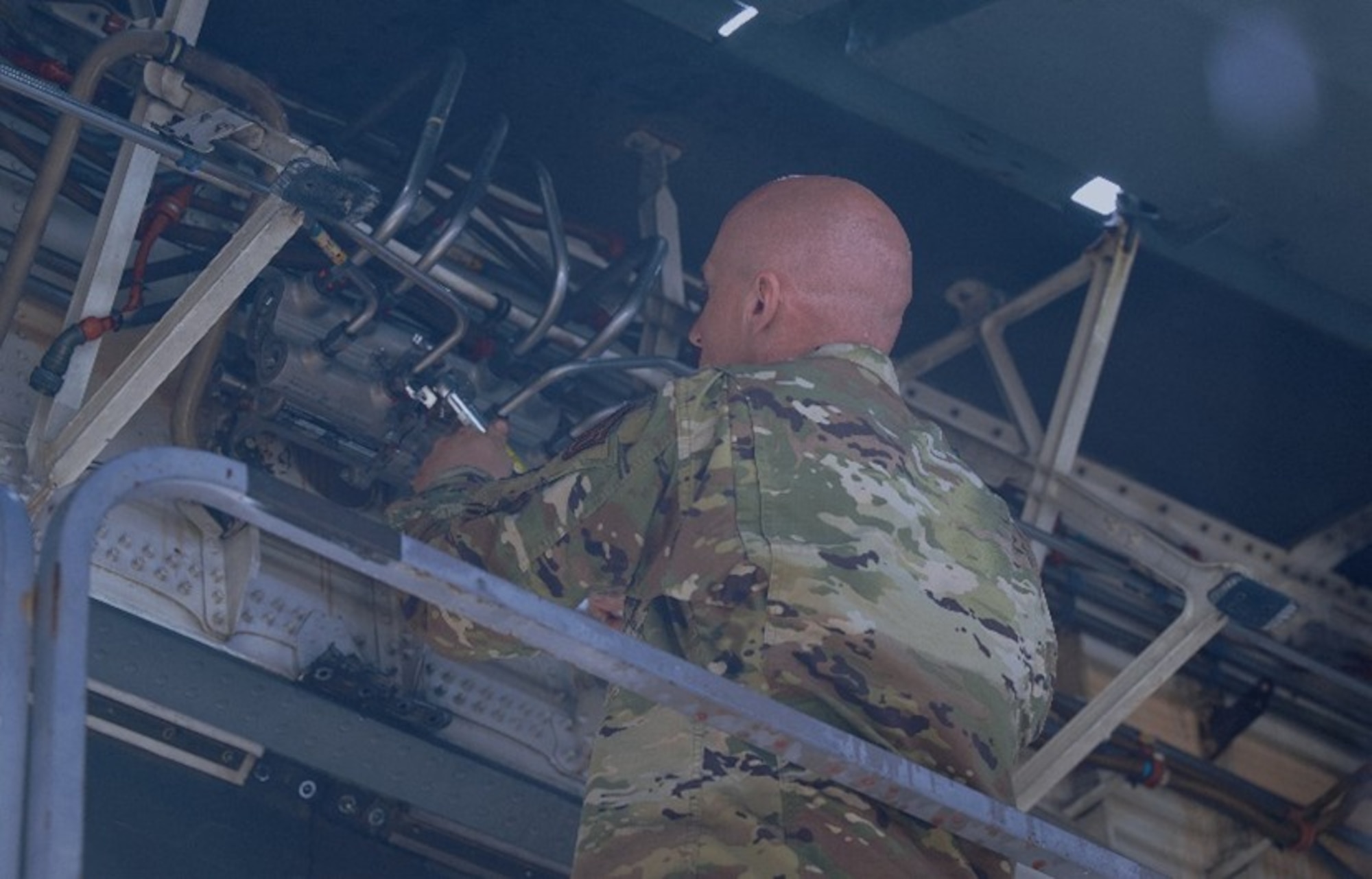 U.S. Air Force Tech. Sgt. Timothy Zottneck, 305th Aircraft Maintenance Squadron hydraulic craftsman, removes a hydraulic line from a tandem control valve module on a C-17 Globemaster III aircraft at Joint Base McGuire-Dix-Lakehurst, N.J., April 22, 2026. The 305th AMXS received the 2025 Air Mobility Command Maintenance Effectiveness Award in the Small Aircraft Maintenance Unit category, showcasing themselves as one of AMC’s most effective maintenance squadrons. (U.S. Air Force photo by 2nd Lt. Gabriel Davenport)