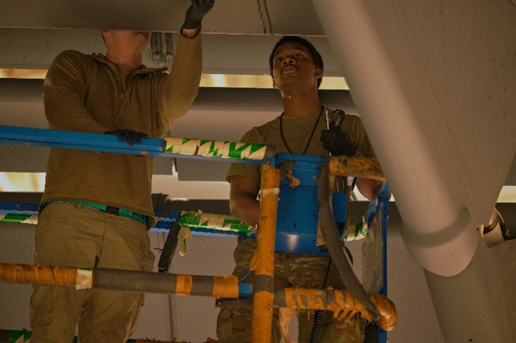 U.S. Air Force Senior Airmen Julian Robb, right, and Robert Cox, both 305th Aircraft Maintenance Squadron home station check C-17 Globemaster III aircraft inspection journeymen, perform maintenance to close a flap dropdown panel on a C-17 at Joint Base McGuire-Dix-Lakehurst, N.J., April 21, 2026. The 305th AMXS received the 2025 Air Mobility Command Maintenance Effectiveness Award in the Small Aircraft Maintenance Unit category, showcasing themselves as one of AMC’s most effective maintenance squadrons. (U.S. Air Force photo by 2nd Lt. Gabriel Davenport)