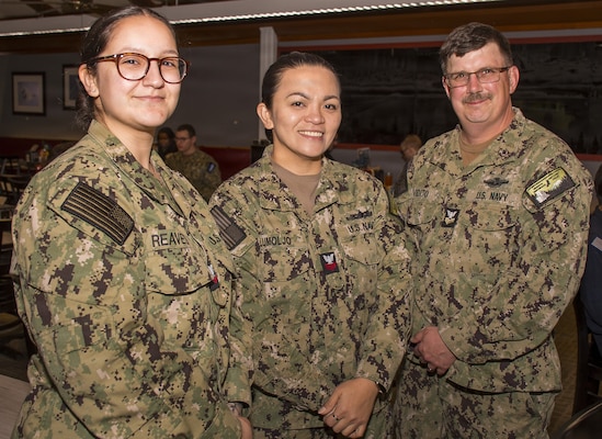 UVA Triad of Navy Medicine Readiness Training Command Bremerton… Hospital Corpsman 1st Class Rose Ann Lumoljo [middle] is flanked by Hospital Corpsman 2nd Class Maritza Reaves [left] and HM1 Joshua Vidito at Naval Base Kitsap SAPR [Sexual Assault Prevention Response] Unit Victim Advocate Appreciation Ceremony, held April 30, 2026. Lumoljo was unanimously selected from among 135 SAPR UVAs for the SAPR Uniformed Victim Advocate of the Year Award,  “in recognition of her leadership, meaningful impact on victims’ lives, and eight years of compassionate service and dedication to the program (Official Navy photo by Mass Communication Specialist 1st Class Jennifer Benedict, NHB/NMRTC Bremerton public affairs).