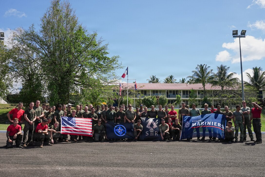 U.S. Marines with India Company, Battalion Landing Team 3/6, 22nd Marine Expeditionary Unit (Special Operations Capable), Dutch Marines, and French soldiers pose for a photo after an “Overlord” event as part of Tres Kolos 26 at Fort-De-France, Martinique, April 24, 2026. Participation in Tres Kolos 26 enhances interoperability with partner nations, reinforces longstanding security relationships, and improves combined readiness to respond to crises across the region. U.S. military forces are deployed to the Caribbean in support of U.S. Southern Command mission objectives and the president's priorities to strengthen regional security, disrupt illicit drug trafficking, and protect the homeland. (U.S. Marine Corps photo)