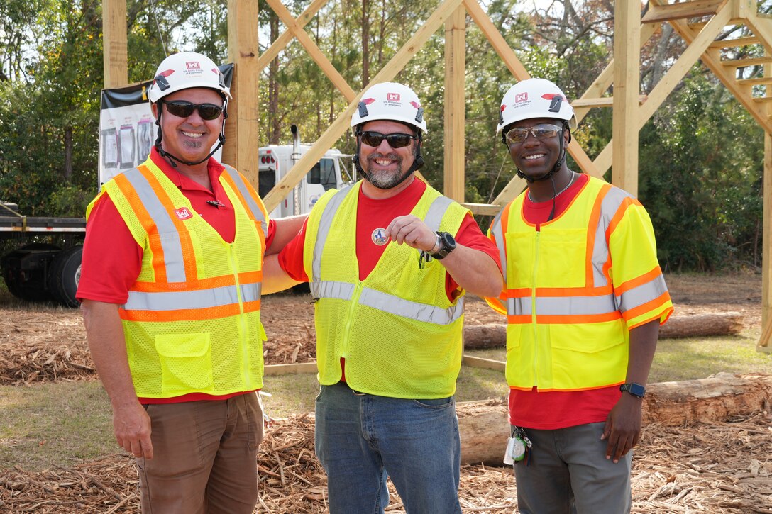 Dan Juracek (left), a safety specialist from U.S. Army Corps of Engineers (USACE), Fort Worth District recognized Chad Stellpflug (middle), a lock & dam operator from St. Paul District for making safety a priority while working as a quality assurance specialist at the Jenkins County temporary debris management site. Jovan Luna (right), a general engineer with Sacramento District, working as the zone manager submitted Stellpflug's name for recognition.