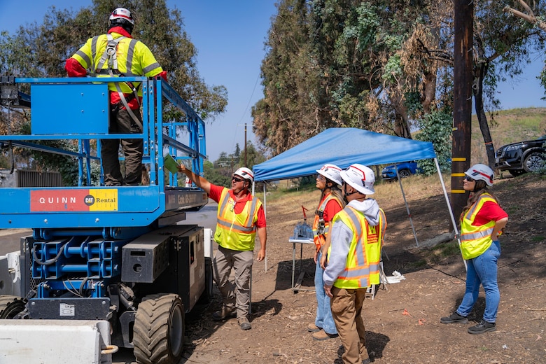 Dan Juracek, safety and occupational health specialist with the Fort Worth District (center) trains quality assurance personnel on the proper use of the scissor lift at the Temporary Debris Staging and Reduction site at Will Rogers Park, June 26, 2025 in Pacific Palisades, California.