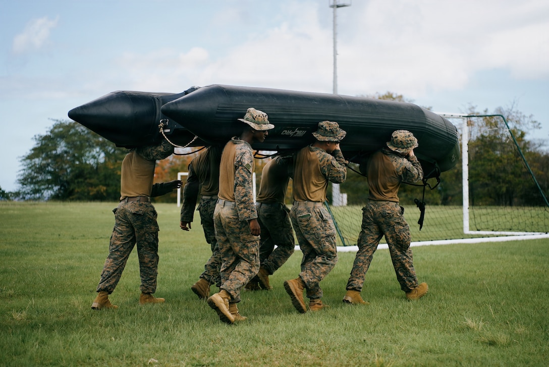 U.S. Marines with India Company, Battalion Landing Team 3/6, 22nd Marine Expeditionary Unit (Special Operations Capable), carry a small boat as part of Tres Kolos 26, at Fort-De-France, Martinique, April 21, 2026. Participation in Tres Kolos 26 enhances interoperability with partner nations, reinforces longstanding security relationships, and improves combined readiness to respond to crises across the region. U.S. military forces are deployed to the Caribbean in support of U.S. Southern Command mission objectives and the president's priorities to strengthen regional security, disrupt illicit drug trafficking, and protect the homeland. (U.S. Marine Corps photo)