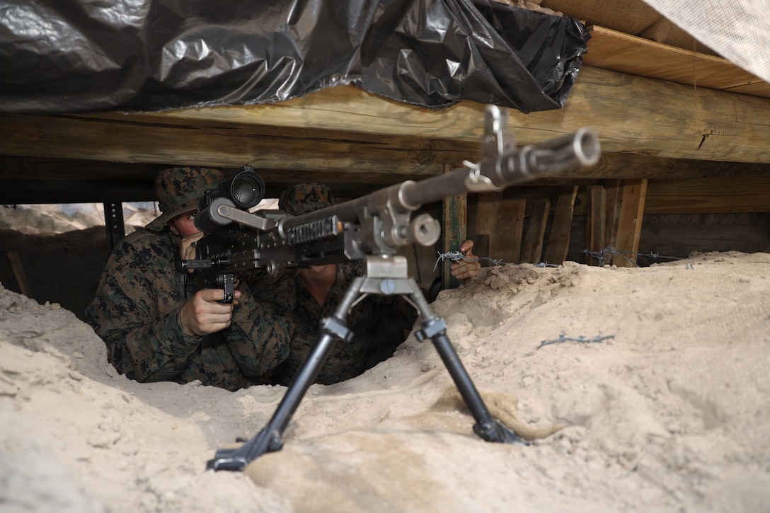 U.S. Marines Corps Cpl. Jonah Stine, a combat engineer with 2nd Combat Engineer Battalion, 2nd Marine Division, posts security during a Marine Corps Combat Readiness Evaluation on Marine Corps Base Camp Lejeune, North Carolina, April 25, 2026. Marines built defensive positions to rehearse preparing an engagement area for enemy contact. 2nd CEB participated in a MCCRE to be assessed on unit combat readiness and their ability to execute mission critical tasks in preparation for future operations and deployments. (U.S. Marine Corps photo by Lance Cpl. Brian Michalski)