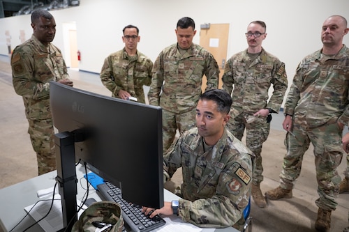 image of an Airman working on a computer.