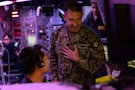 U.S. Navy Admiral Brad Cooper, commander of U.S. Central Command, speaks with a Sailor in the combat information center aboard America-class amphibious assault ship USS Tripoli (LHA 7). Cooper interacted with Sailors and Marines and toured various spaces aboard the amphibious assault ship. Tripoli is deployed to the U.S. 5th Fleet area of operations to support maritime security and stability in the Middle East. (U.S. Navy photo by Senior Chief Mass Communication Specialist Amanda Dunford)