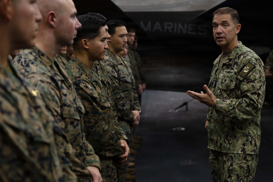 U.S. Navy Admiral Brad Cooper, Commander of U.S. Central Command, speaks with the America-class amphibious assault ship USS Tripoli (LHA 7) crew in the hangar bay during an awards quarters. Cooper interacted with Sailors and Marines and toured various spaces aboard the amphibious assault ship. Tripoli is deployed to the U.S. 5th Fleet area of operations to support maritime security and stability in the Middle East. (U.S. Navy photo by Senior Chief Mass Communication Specialist Amanda Dunford)