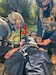 U.S. Army medics Pfc. Carter Borah, left, and Pfc. Roman Farrell right, both with 1st Battalion, 4th Infantry Regiment, fill out a tactical Combat casualty care card and start intravenous fluid therapy on a simulated casualty, during exercise Combined Resolve 26-07 April 25, 2026, at Hohenfels Training Area, Hohenfels, Germany. U.S. Army Active Duty medics with 1st Bn., 4th Inf. Regt. and U.S. Army Reserve medics with the 369th, 345th and 349th Medical Detachments from Jacksonville, Florida, and the 331st Minimal Care Detachment from Miami, Florida, teamed up to perform subterranean casualty care in response to a simulated drone warfare threat during exercise Combined Resolve 26-07 from April 22nd to May 1st Hohenfels Training Area, Hohenfels, Germany. (U.S. Army photo by Sgt. Caleb Norman, 1st Battalion, 4th Infantry Regiment.)