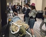 Hannah Acevedo, left, an electronics technician with U.S. Army Medical Logistics Command, talks to high school students during a career exploration event, hosted by Junior Achievement of Northeastern Pennsylvania over April 14-15 at Mohegan Pennsylvania near Wilkes-Barre, Pennsylvania.