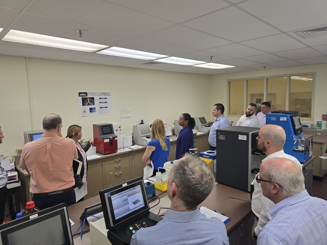 People view equipment in lab.