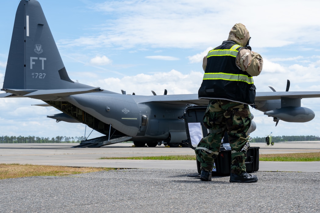 Man walks toward an aircraft.