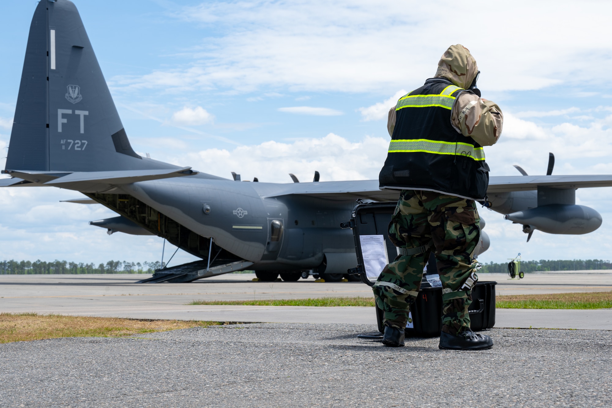 Man walks toward an aircraft.