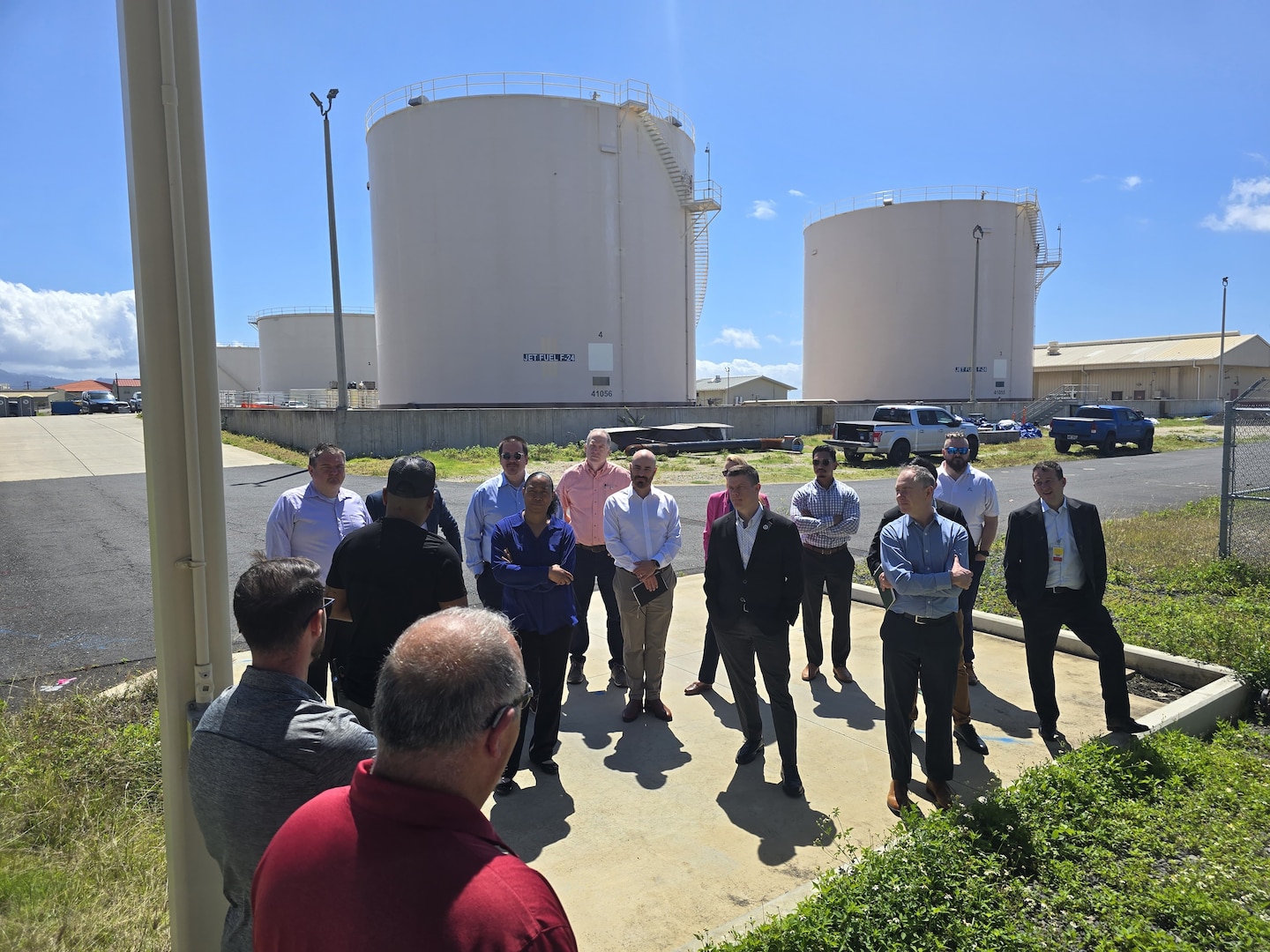 A group of people receive a briefing and site tour.