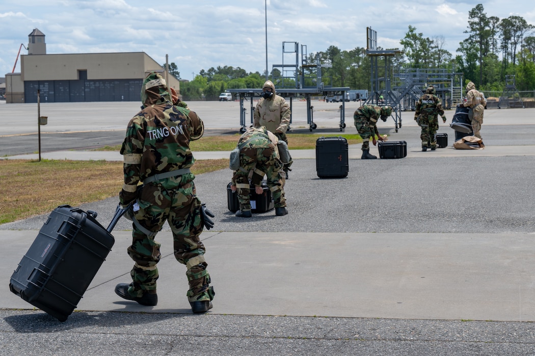 People carry equipment.