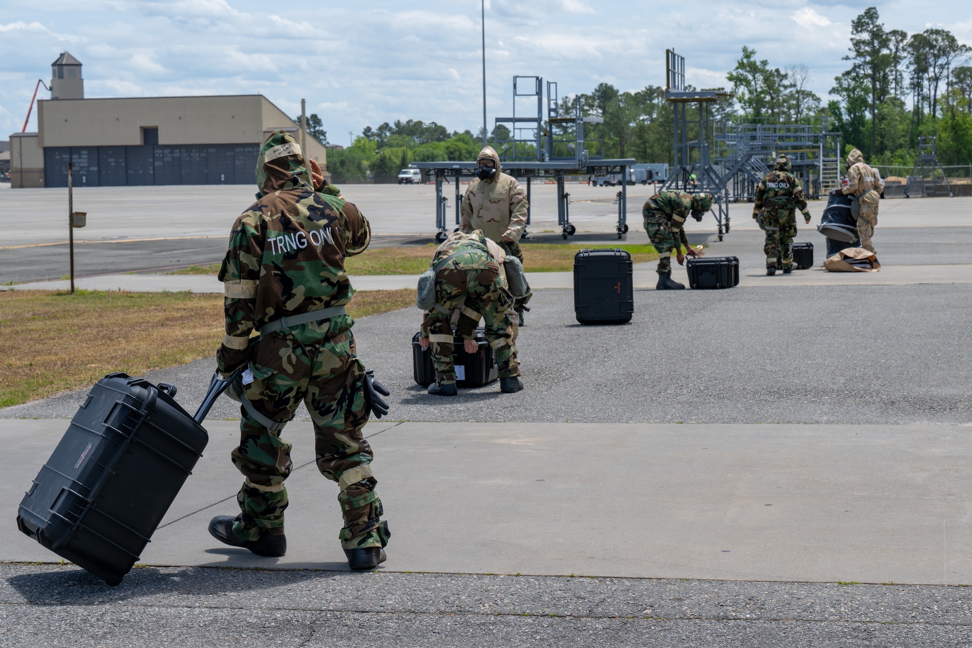 People carry equipment.