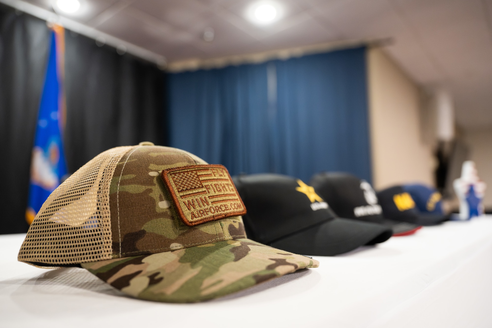 Hats representing various branches of the U.S. military sit on a table during the Military Signing Day ceremony at Dyess Air Force Base, Texas, April 30, 2026. Military Signing Day is a ceremony that honors students who have committed to joining the United States Armed Forces after their high school graduation. (U.S. Air Force Photo by Airman 1st Class Caleb Schellenberg)