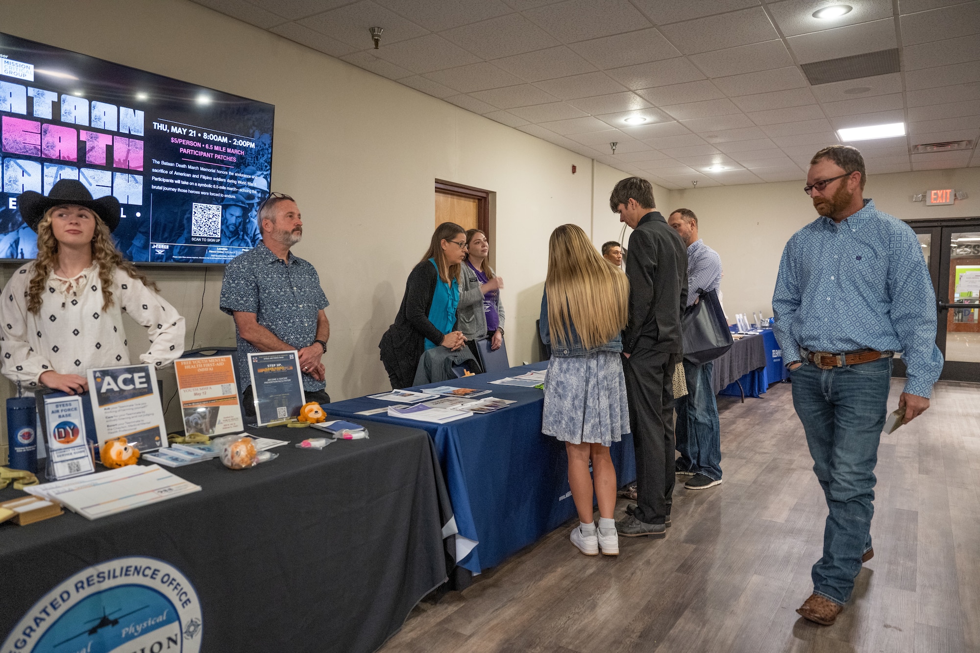 Representatives from installation support agencies provide information to Military Signing Day attendees at Dyess Air Force Base, Texas, April 30, 2026. The agencies manned information booths to spread awareness of the benefits and assistance programs available to the future service members. (U.S. Air Force Photo by Airman 1st Class Caleb Schellenberg)