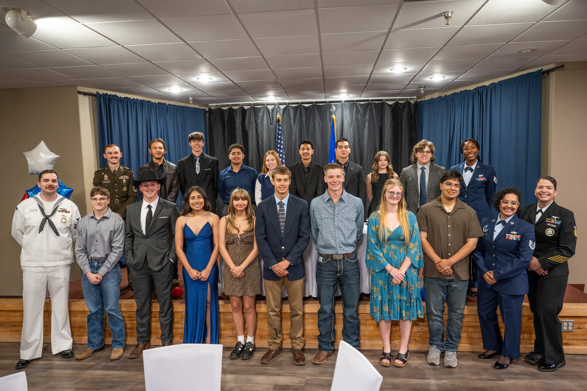 Sixteen local high school students pose alongside military recruiters for a photo during the first Military Signing Day event at Dyess Air Force Base, Texas, April 30, 2026. Many of the students honored at the event will attend basic training this summer, marking the first step in their military career before advancing to their specialized individual training. (U.S. Air Force Photo by Airman 1st Class Caleb Schellenberg)