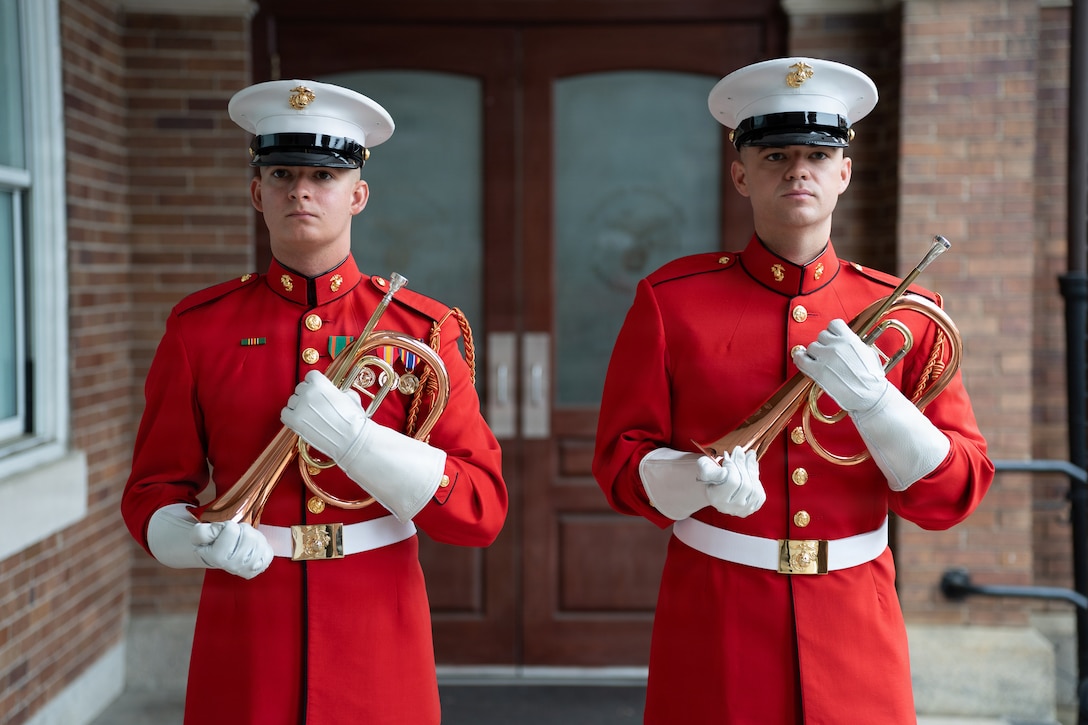 U.S. Marine Corps Sgt. Michael Rosie, ceremonial bugler, "The Commandant's Own" United States Marine Drum & Bugle Corps, Marine Barracks Washington, left, and Cpl. Quinton Mashler, assistant ceremonial bugler, "The Commandant's Own" United States Marine Drum & Bugle Corps, Marine Barracks Washington, pose for a photo at Marine Barracks Washington, D.C., April 3, 2026. Marine Barracks Washington has selected Rosie as the 2026 Parade Season ceremonial bugler, with Cpl. Quinton Mashler serving as assistant, continuing a tradition that dates back decades during Evening and Sunset Parades. As the Marine Corps prepares to support America’s 250th anniversary, both Marines take on heightened responsibility, representing not only musical excellence but also the historical significance of the bugle in military tradition. (Courtesy Photo)