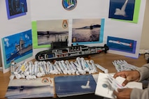 A submarine model on display in the hallways at Portfolio Acquisition Executive (PAE) Strategic Systems Program (SSP) in Washington D.C. on April 23, 2026. To support the children’s learning and understanding of PAE SSP, kids were handed a “Qualification Card,” challenging them to visit as many PAE SSP branch booths as they could and to jot down some interesting facts. This challenge gave kids the opportunity to participate in several specialties that support PAE SSP’s mission, such as negotiating a deal, building a structure with everyday supplies, or launching a small home-made aircraft, among more.