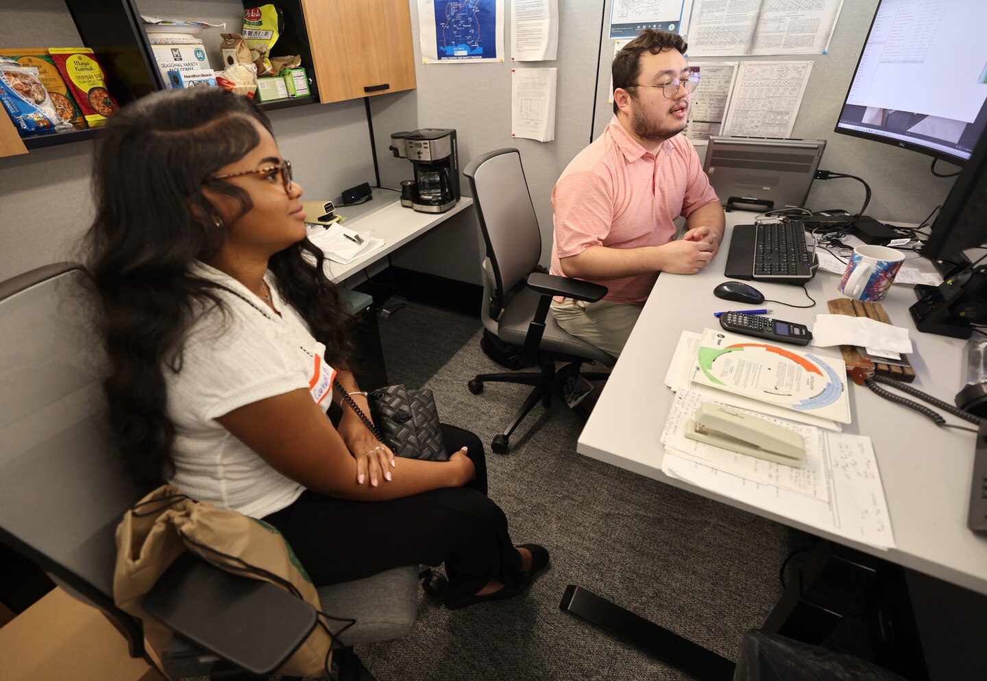 Picture of a some students being talked to by a Corps of Engineers Employee.