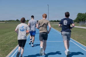 Airmen assigned to the 137th Special Operations Wing, Oklahoma Air National Guard, run on the Will Rogers Air National Guard Base track.