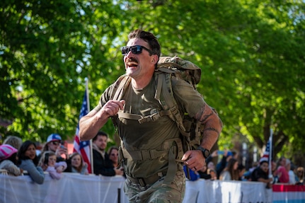Spc. Seamus Collins,Troop C, 1-134th Cavalry Squadron, Nebraska Army National Guard, rucks in the 49th annual Lincoln Marathon and Half Marathon in Lincoln, Nebraska, May 3, 2026.