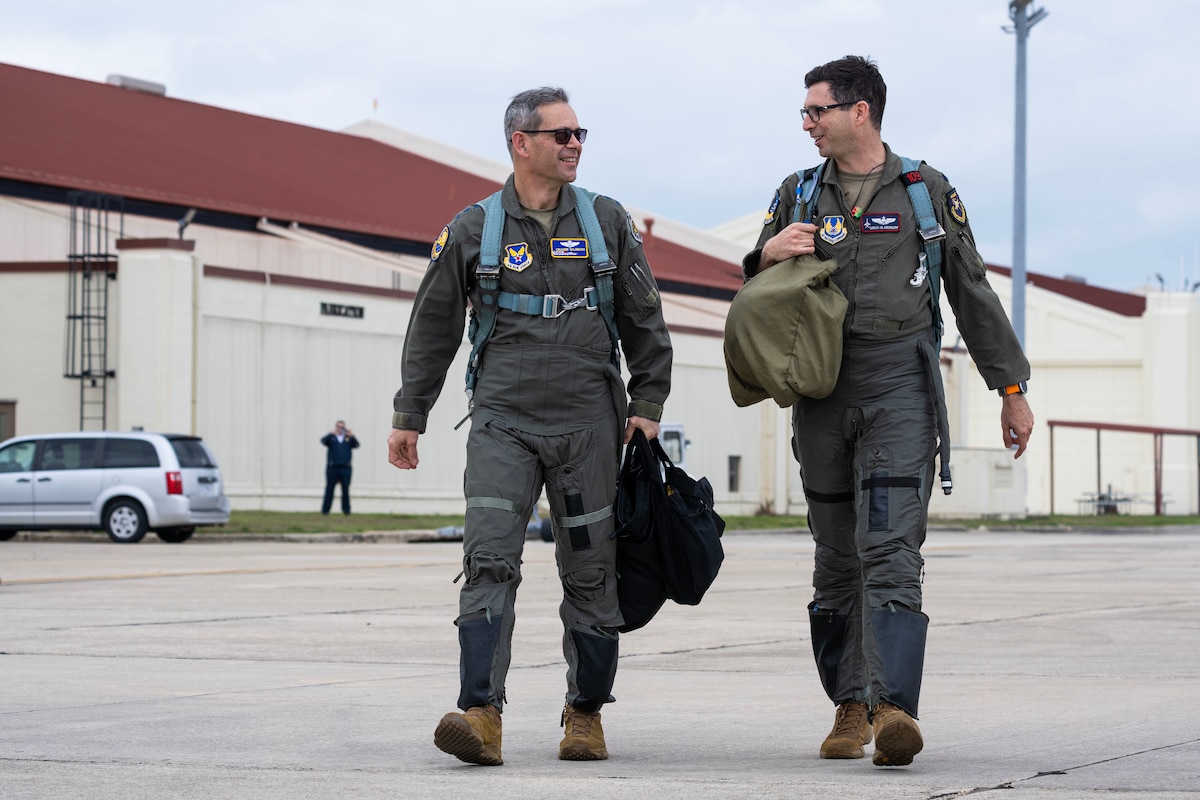 CSAF and 416th director of operations walking on the flightline.