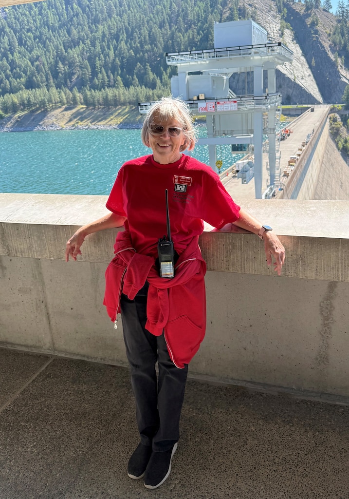 A woman standing in the Treaty Towers above Libby Dam, in Libby Montana.