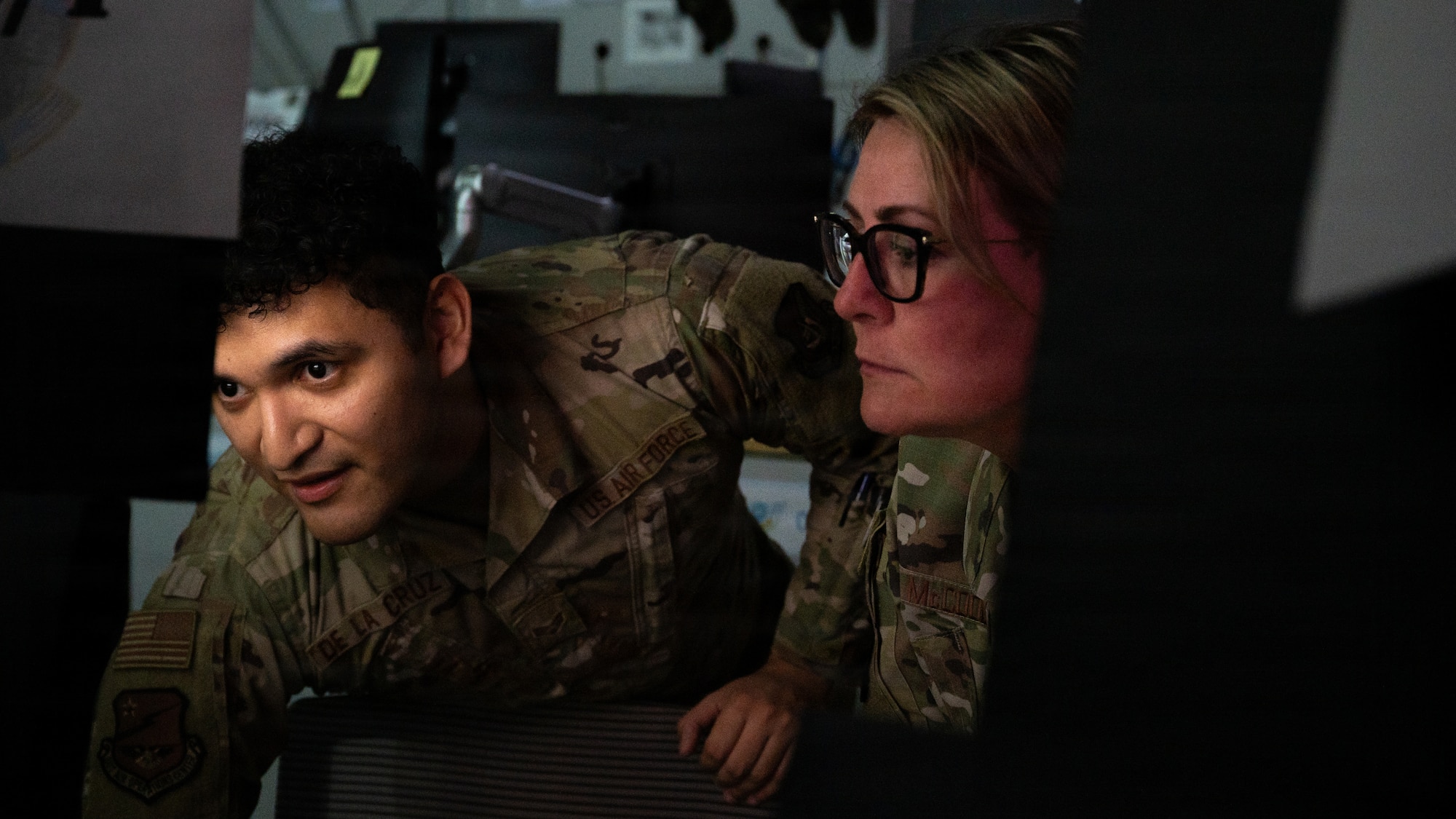U.S. Air Force Chief Master Sgt. Katie McCool, Pacific Air Forces command chief, receives a mission briefing from a 607th Air Operations Center Airman at Osan Air Base, Republic of Korea, April 23, 2026. 607th AOC’s mission is to plan, direct, and assess air and space operations in support of combined U.S. and ROK. forces. (U.S. Air Force photo by Senior Airman Jessica Mun)