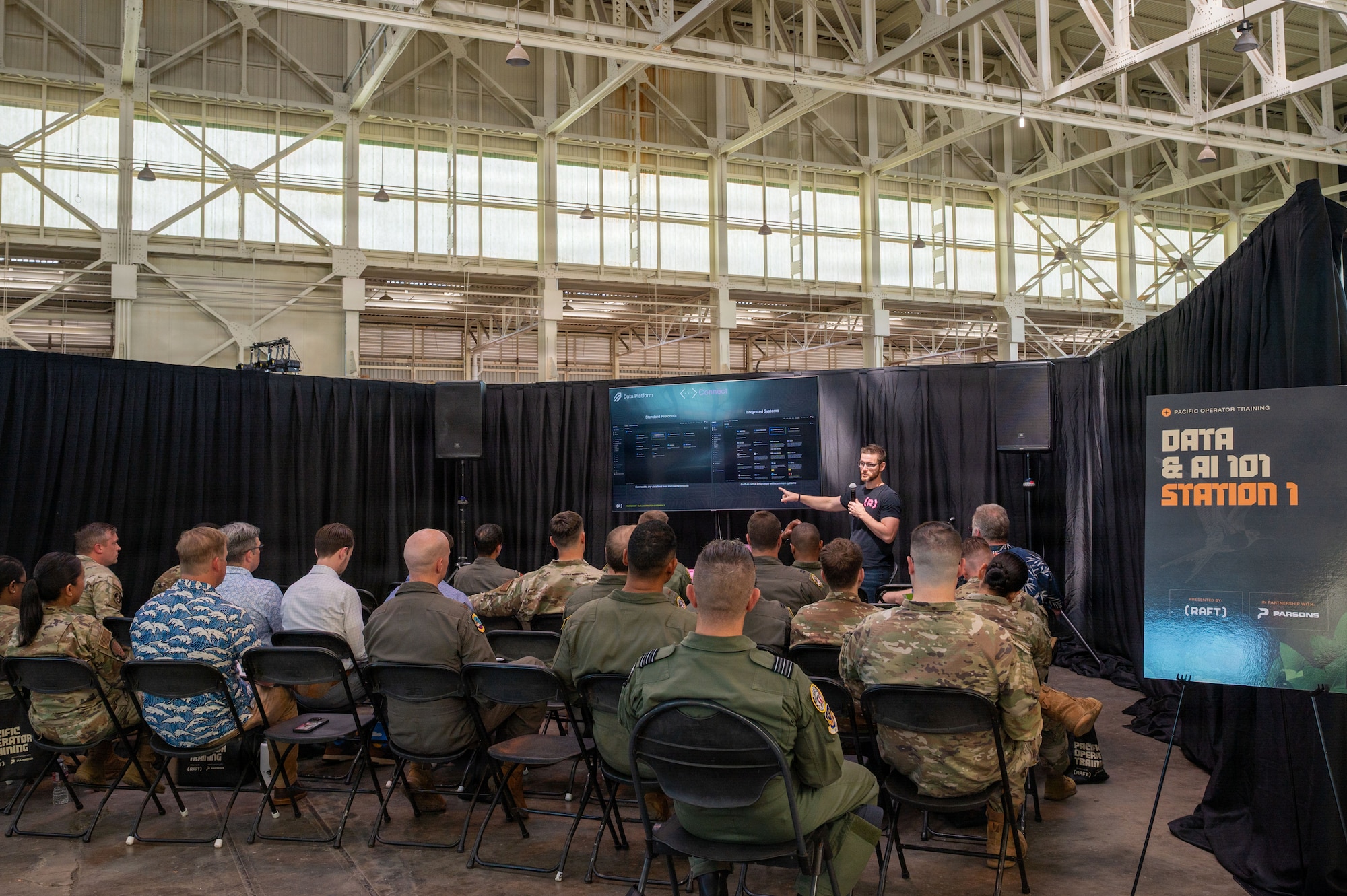 An industry partner briefs joint force attendees on artificial intelligence capabilities during Pacific Operator Training Day at Joint Base Pearl Harbor-Hickam, Hawaii, April 28, 2026.