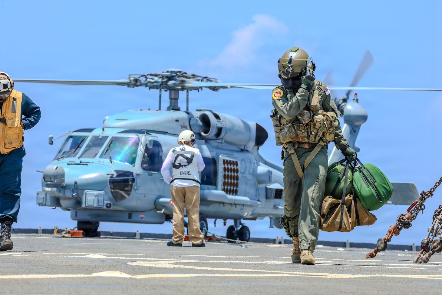 Royal Australian Navy Petty Officer Liam Sulley disembarks an MH-60R Seahawk, assigned to RAN Anzac-class frigate HMAS Toowoomba (FFH 156), on the flight deck of U.S. Navy Whidbey Island-class dock landing ship USS Ashland (LSD 48) during Exercise Balikatan 2026 in the South China Sea, April 26, 2026. Balikatan is a longstanding annual exercise between the Armed Forces of the Philippines and U.S. military that represents the strength of our alliance, improves our capable combined force, and demonstrates our commitment to regional peace and prosperity. (U.S. Navy photo by Mass Communication Specialist Seaman Maliq J. Martin)