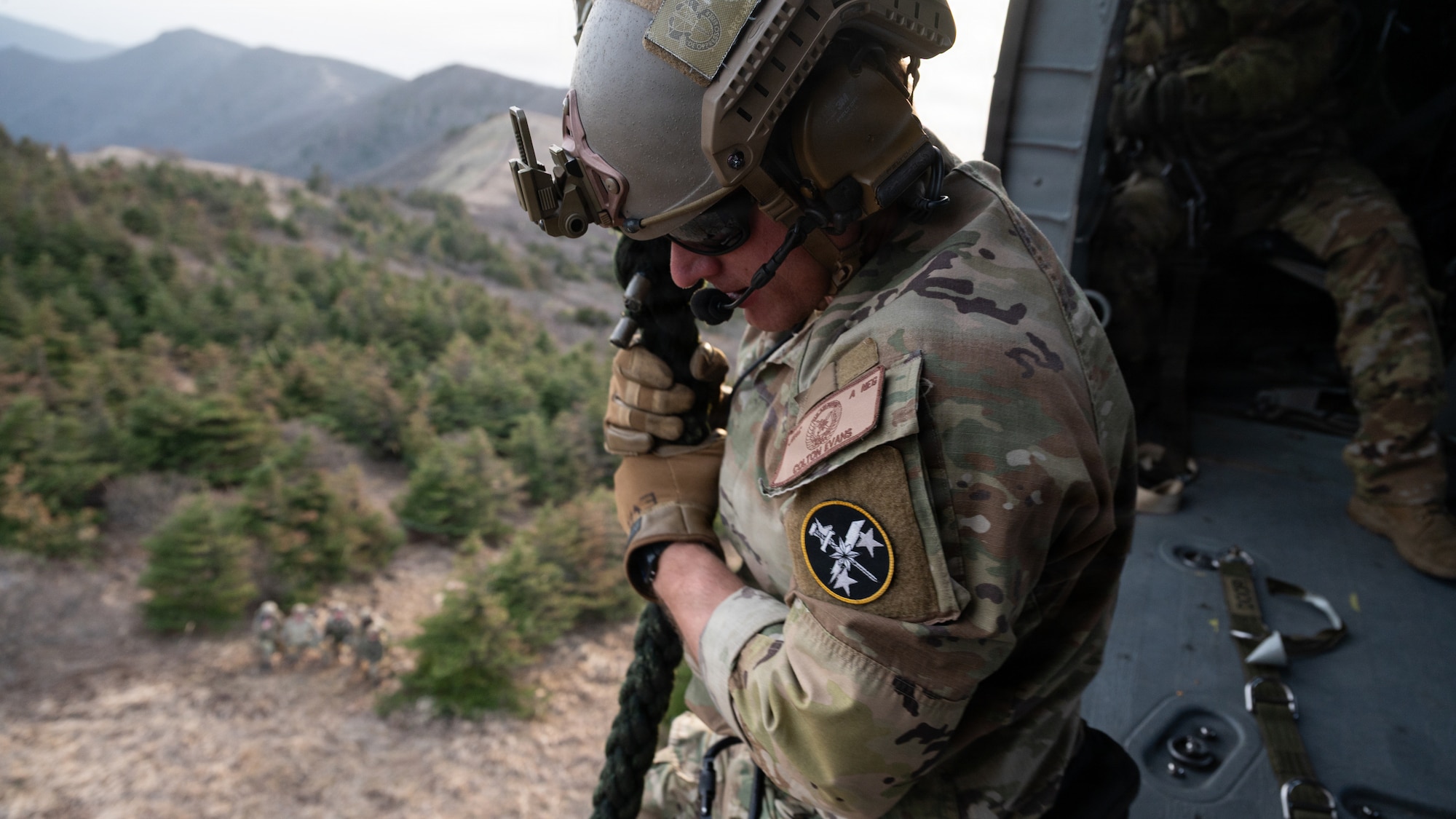 U.S. Air Force Staff Sgt. Colton Evans, Tactical Air Control Party Operator and Fast Rope Insertion Extraction System master assigned to the 604th Air Support Operations Squadron, gets ready to fast rope out of a UH-60 Black Hawk at Sobaeksan National Park, Republic of Korea, April 21, 2026. TACP operators conducted FRIES and target acquisition training during exercise Freedom Flag 26-1, simulating real-world area reconnaissance operations. FF 26-1 is a combined exercise between U.S. and Republic of Korea air forces on the Korean peninsula designed to enhance readiness through realistic, complex training scenarios.  (U.S. Air Force photo by Senior Airman Jessica Mun)