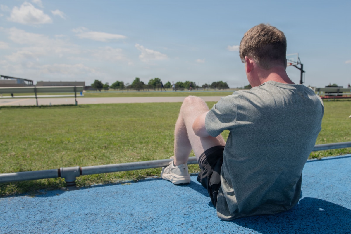 An Airman assigned to the 137th Special Operations Wing, Oklahoma Air National Guard, performs situps for the U.S. Air Force Physical Fitness Assessment.